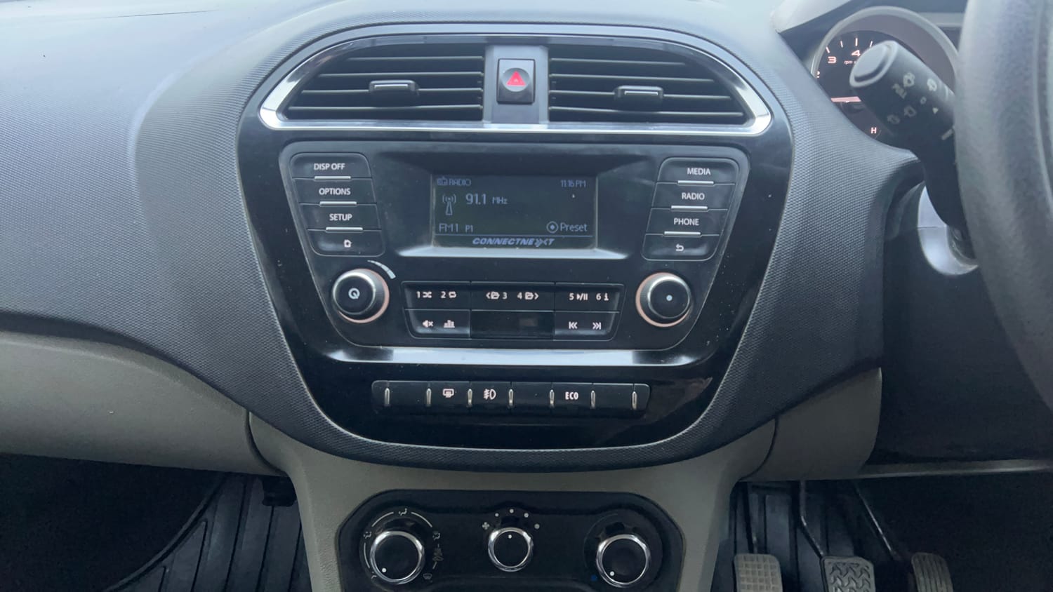 Used 2016 Tata Tiago Revotron XZ Petrol Manual interior MUSIC SYSTEM & AC CONTROL VIEW