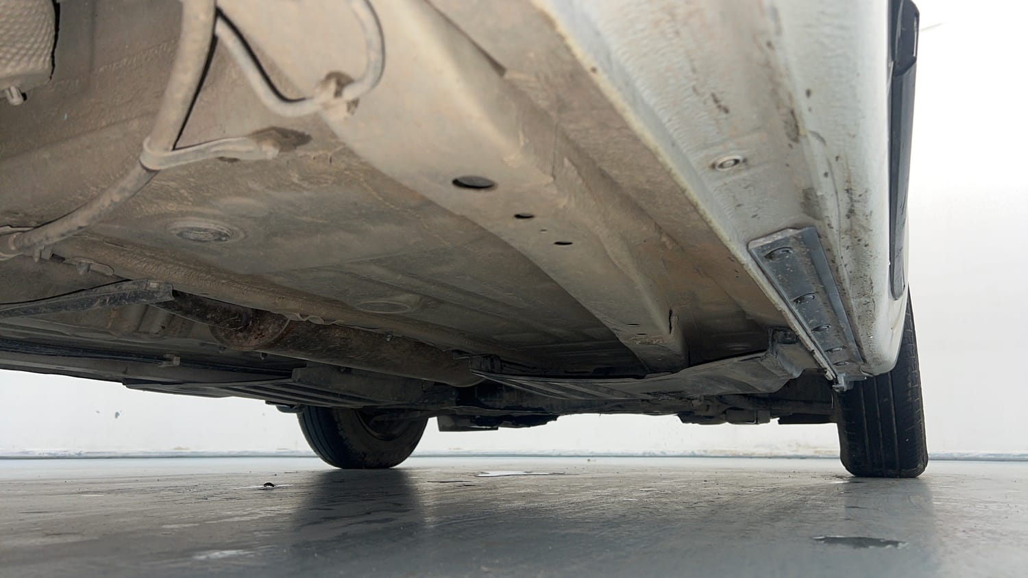 Used 2021 Maruti Suzuki Dzire VXi Petrol Manual extra REAR RIGHT UNDERBODY VIEW