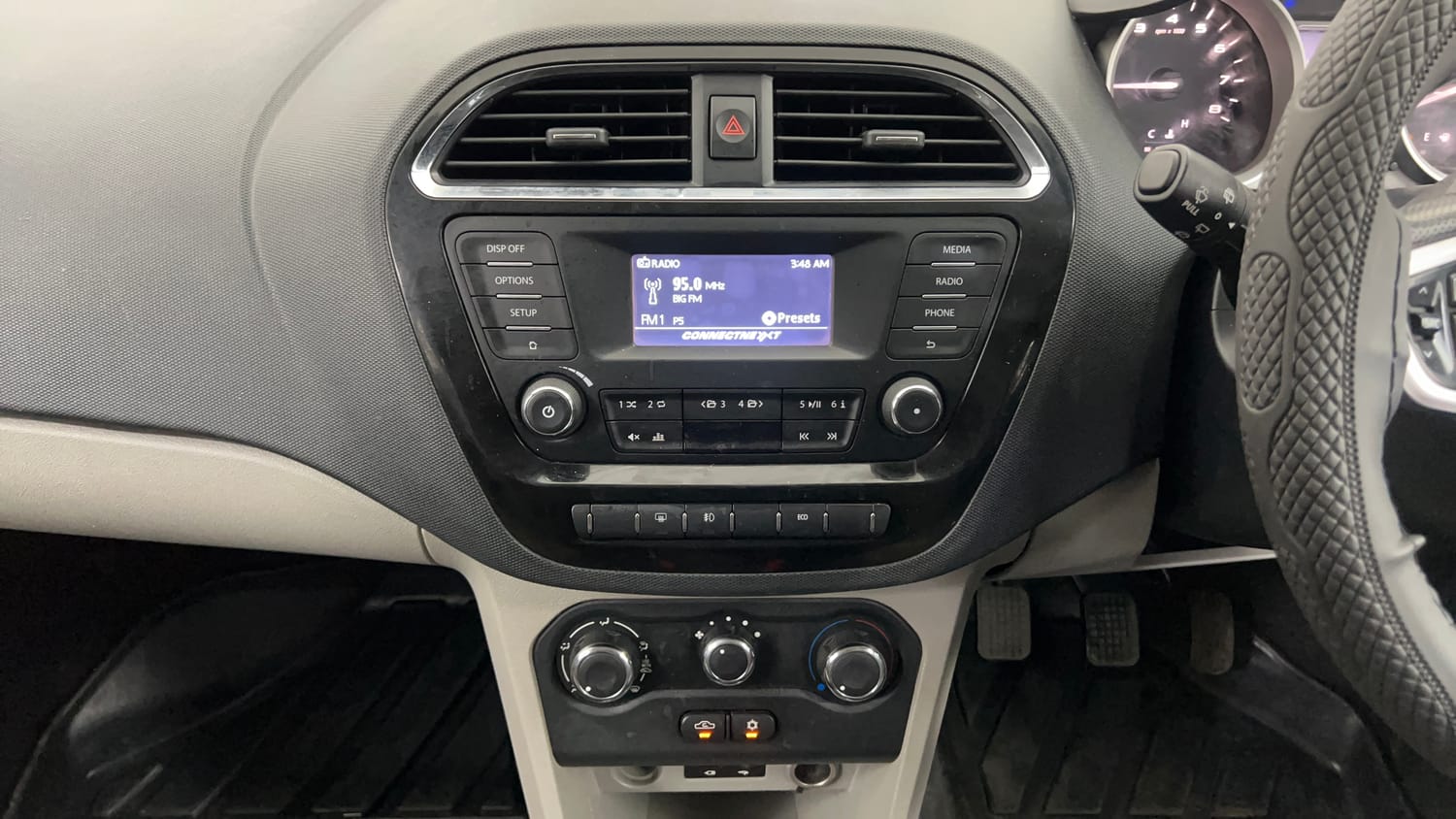 Used 2017 Tata Tiago Revotron XE (O) Petrol Manual interior MUSIC SYSTEM & AC CONTROL VIEW