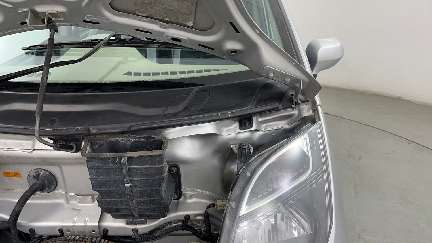 Used 2015 Tata Nano Twist XTA Petrol Automatic engine ENGINE LEFT SIDE HINGE & APRON VIEW