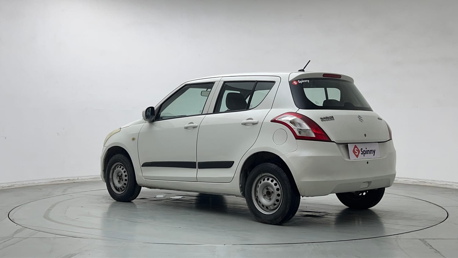 Used 2017 Maruti Suzuki Swift Lxi (O) Petrol Manual exterior LEFT REAR CORNER VIEW