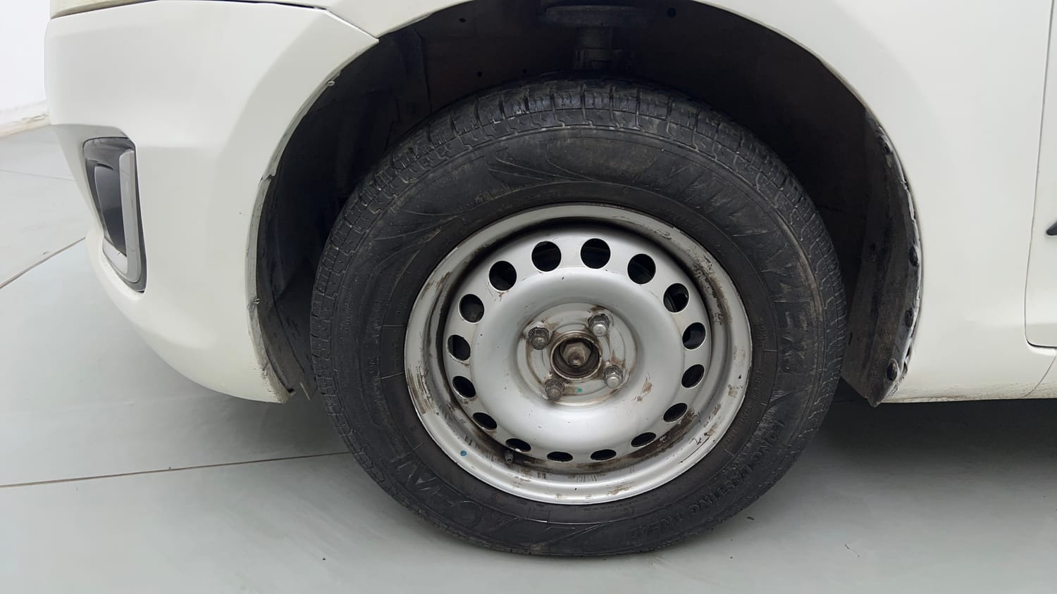 Used 2017 Maruti Suzuki Swift Lxi (O) Petrol Manual tyres LEFT FRONT TYRE RIM VIEW