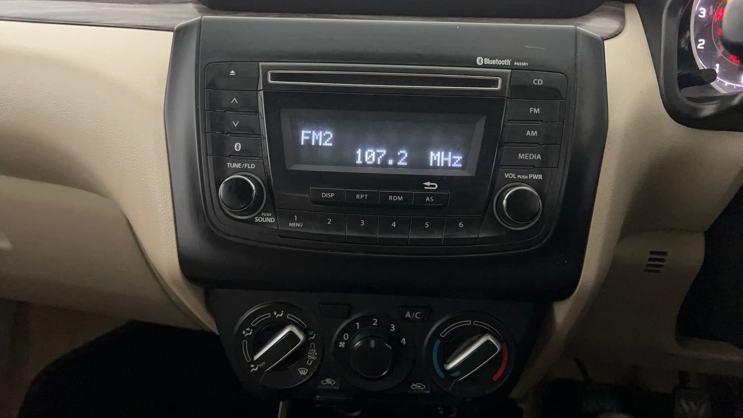 Used 2021 Maruti Suzuki Dzire VXi Petrol Manual top_features Integrated (in-dash) music system