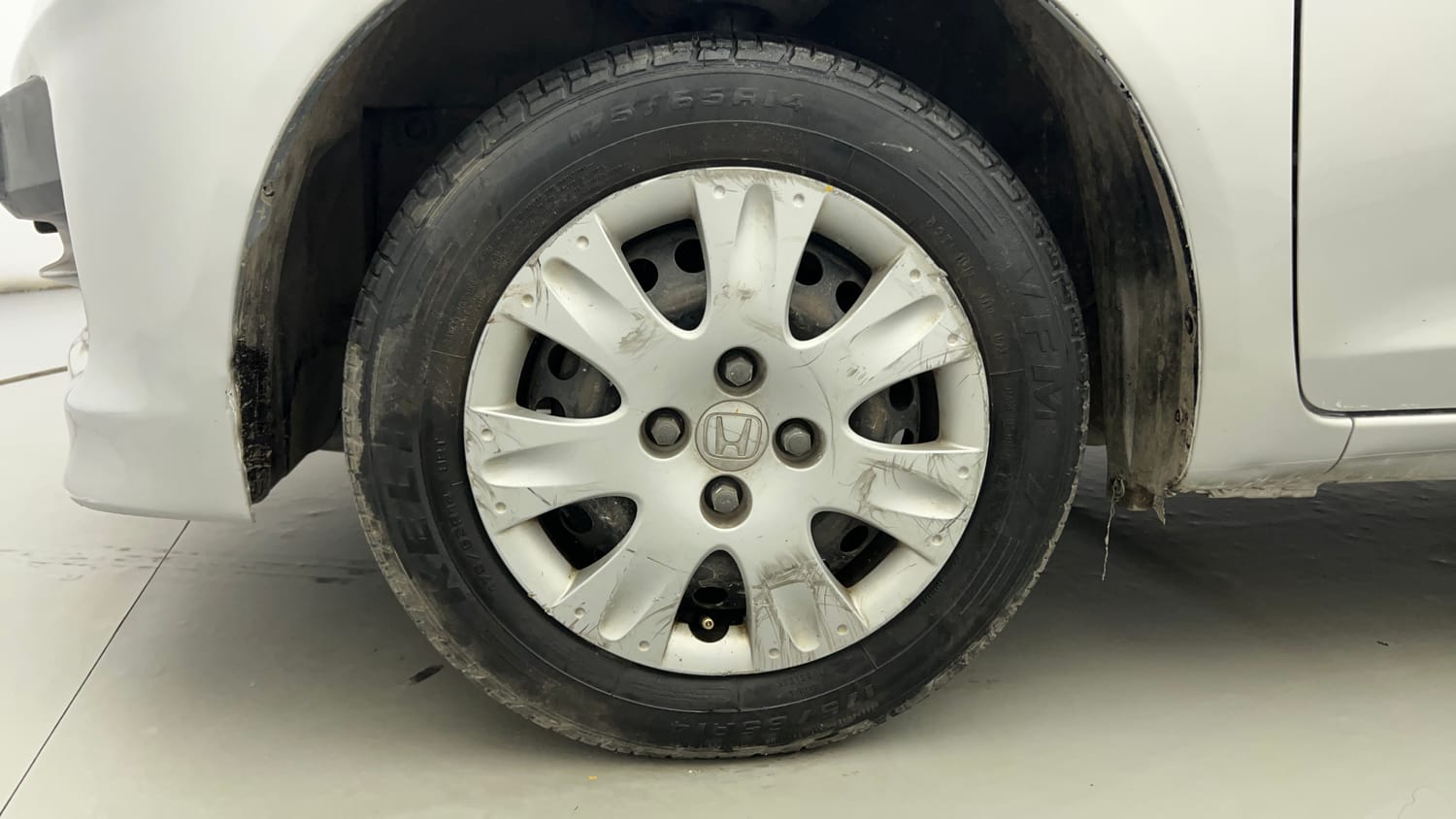 Used 2013 Honda Brio S MT Petrol Manual tyres LEFT FRONT TYRE RIM VIEW