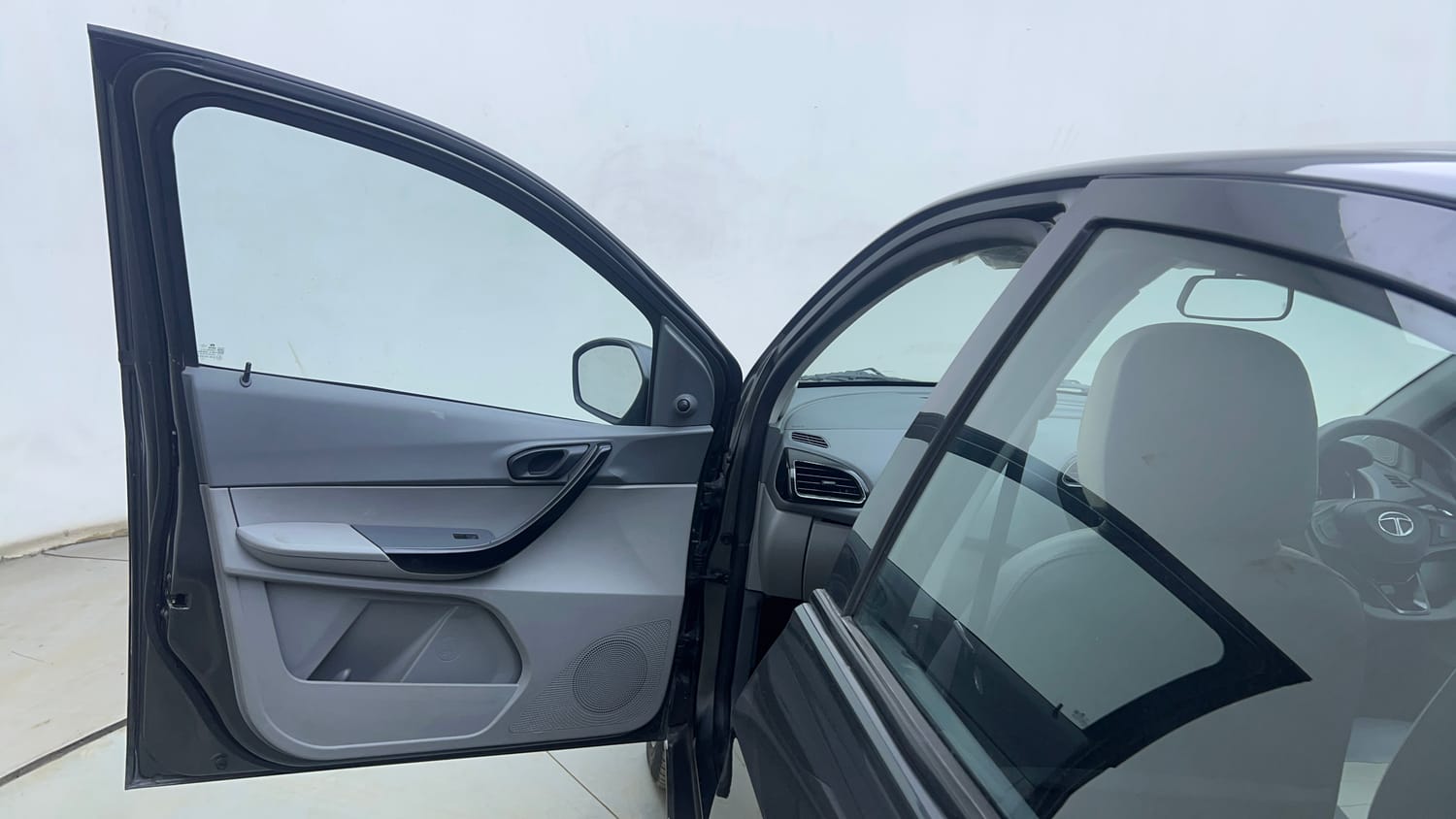 Used 2022 Tata Tigor XMA Petrol Automatic interior LEFT FRONT DOOR OPEN VIEW
