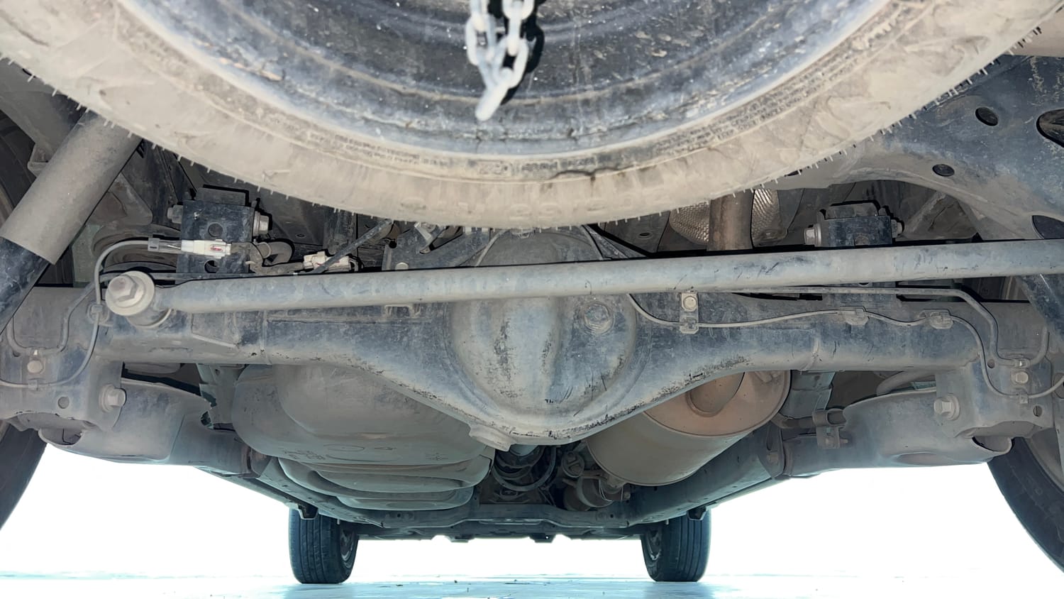 Used 2022 Toyota Innova Crysta GX 2.7 AT 7 STR Petrol Automatic extra REAR UNDERBODY VIEW (TAKEN FROM REAR)