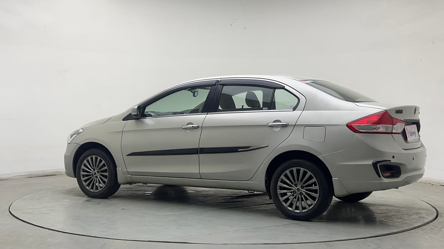 Used 2015 Maruti Suzuki Ciaz ZXI+ Petrol Manual exterior LEFT REAR CORNER VIEW