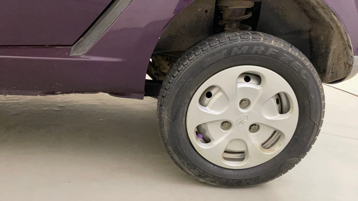 Used 2015 Tata Nano Twist XT Petrol Manual tyres LEFT REAR TYRE RIM VIEW