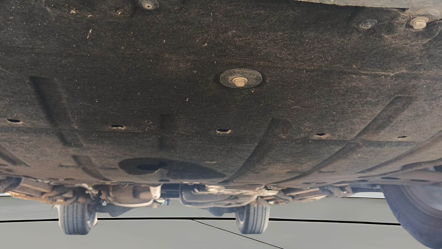 Used 2025 Mahindra XUV700 AX7 Luxury Pack Petrol AT 7 STR Petrol Automatic extra FRONT LEFT UNDERBODY VIEW