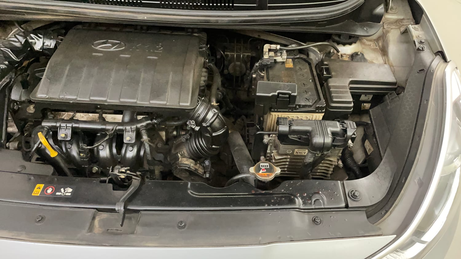 Used 2022 Hyundai Grand i10 Nios Sportz AMT 1.2 Kappa VTVT Petrol Automatic engine ENGINE LEFT SIDE VIEW
