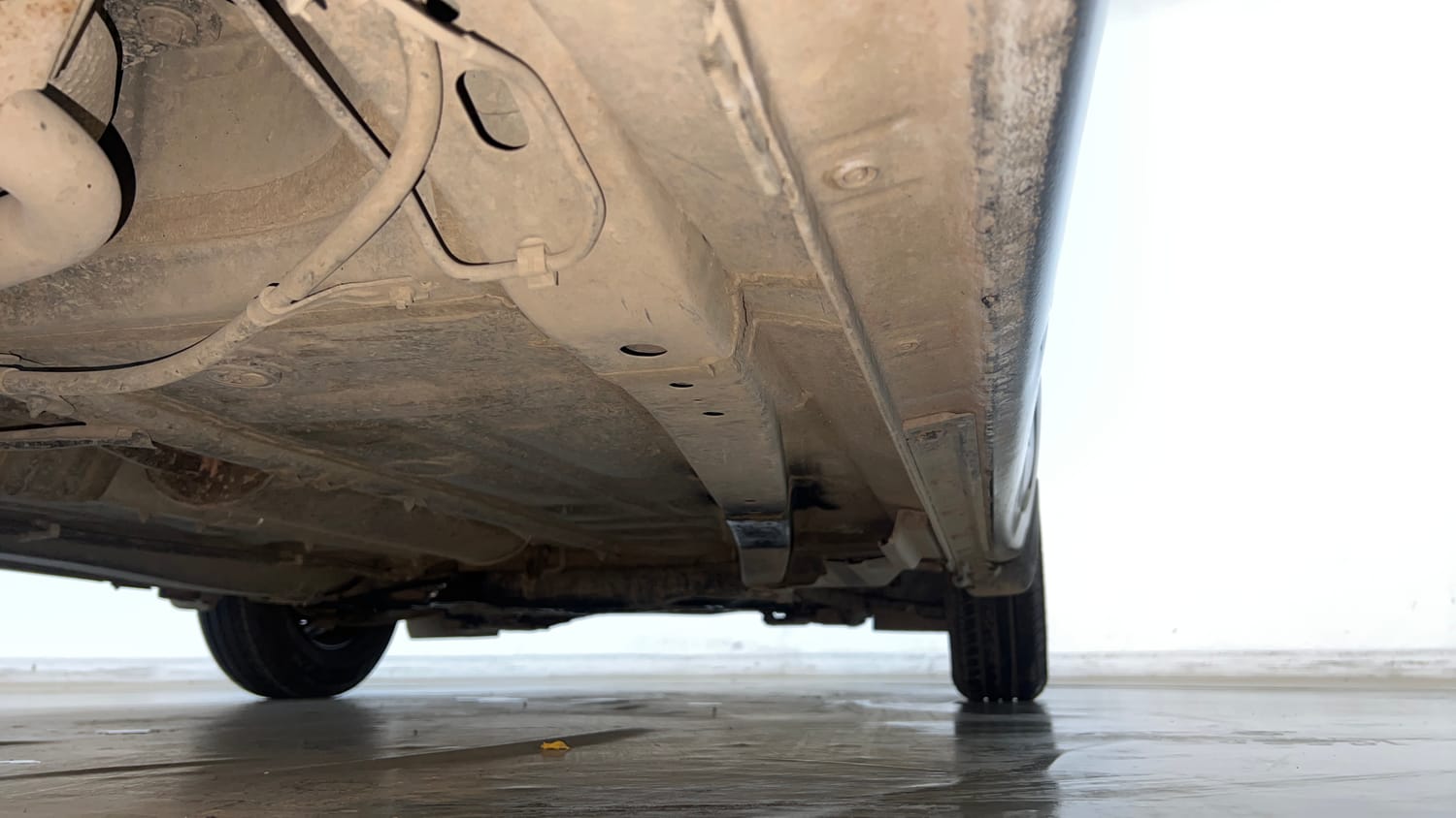 Used 2022 Maruti Suzuki Dzire LXi Petrol Manual extra REAR RIGHT UNDERBODY VIEW