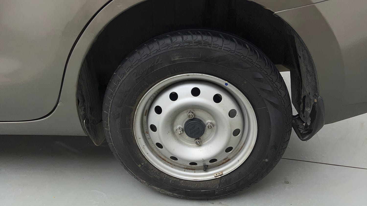Used 2022 Maruti Suzuki Dzire LXi Petrol Manual tyres LEFT REAR TYRE RIM VIEW