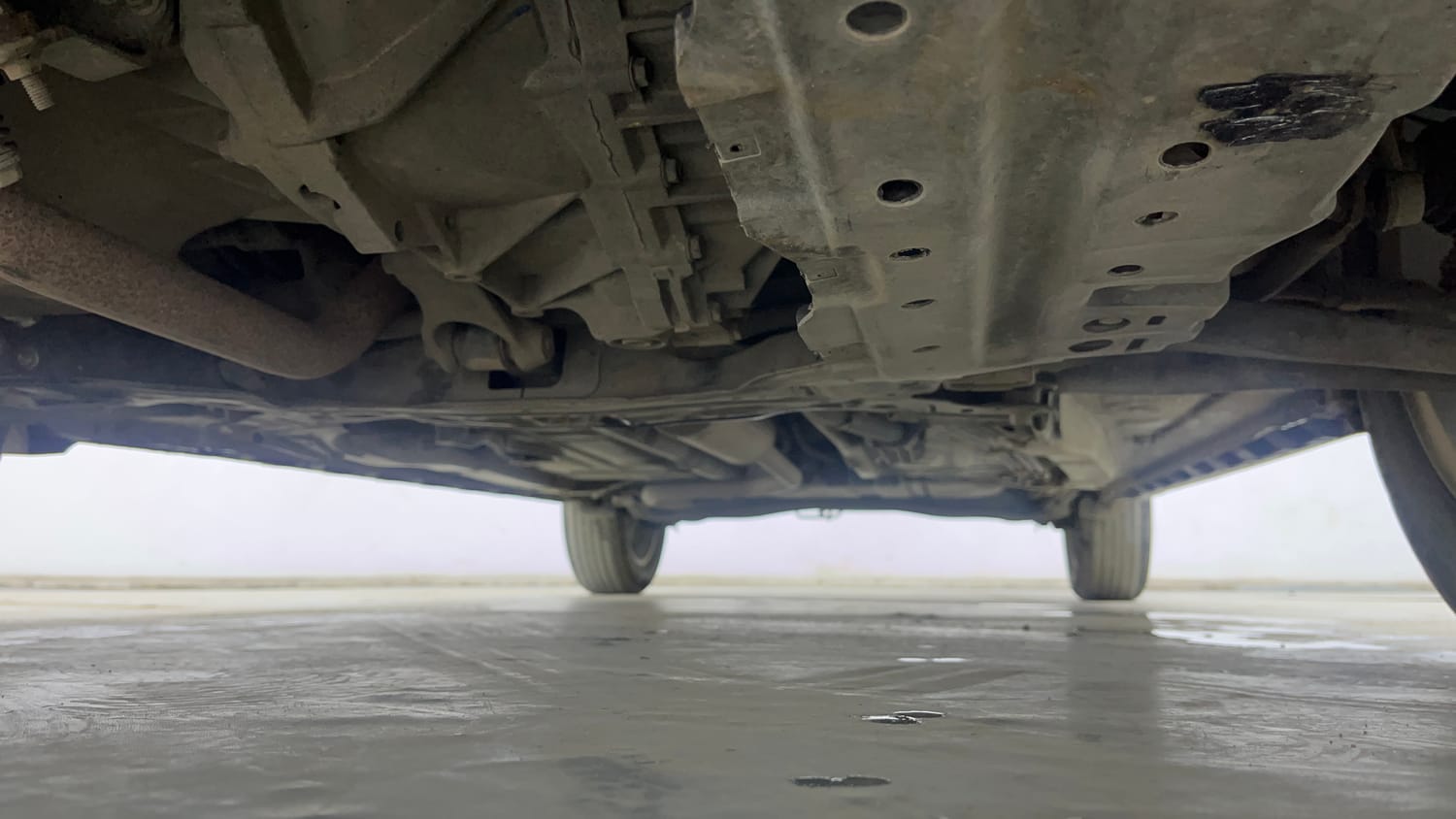 Used 2022 Maruti Suzuki XL6 Alpha MT Petrol Petrol Manual extra FRONT LEFT UNDERBODY VIEW