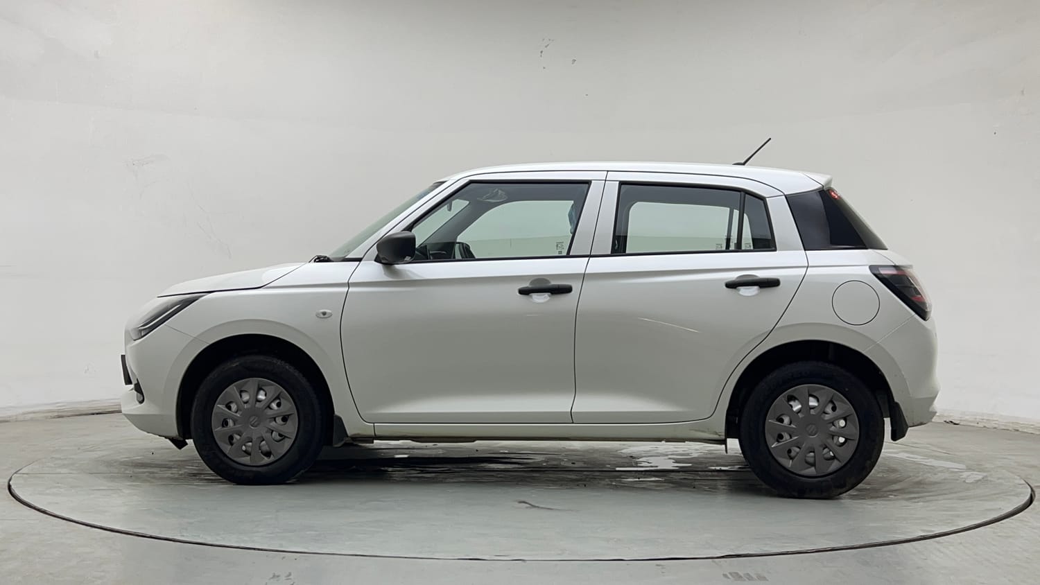 Used 2025 Maruti Suzuki Swift LXi Petrol Manual exterior LEFT SIDE VIEW