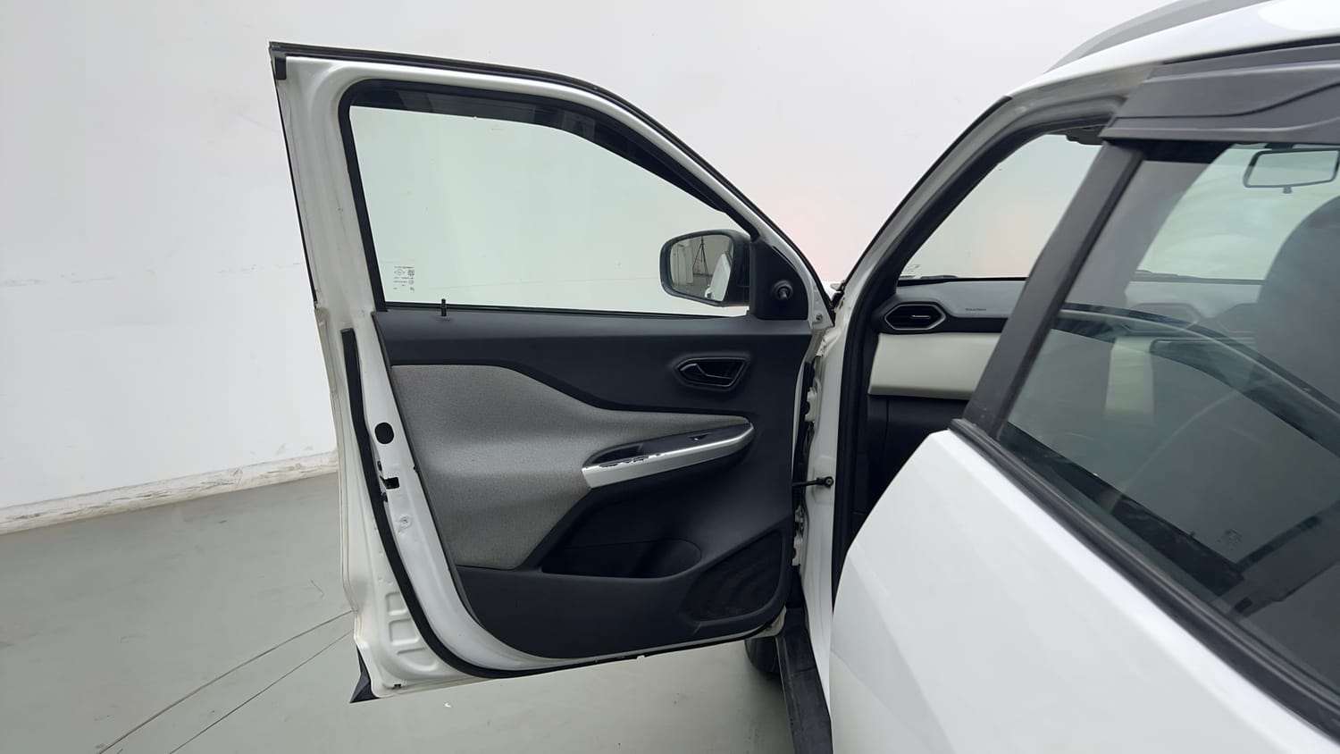 Used 2022 Nissan Magnite XE Petrol Manual interior LEFT FRONT DOOR OPEN VIEW