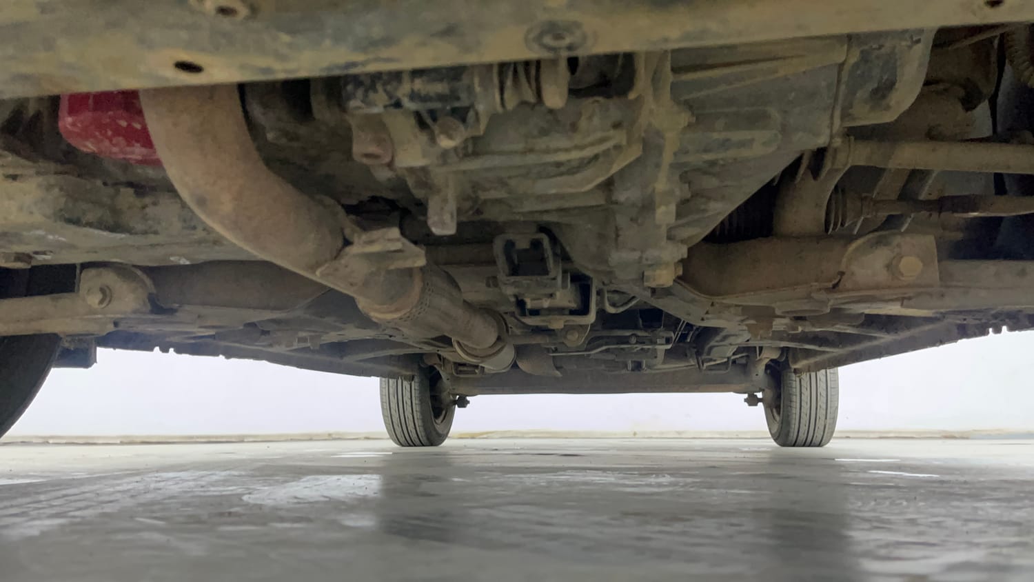 Used 2017 Mahindra KUV100 K6+ 5 STR Petrol Manual extra FRONT LEFT UNDERBODY VIEW