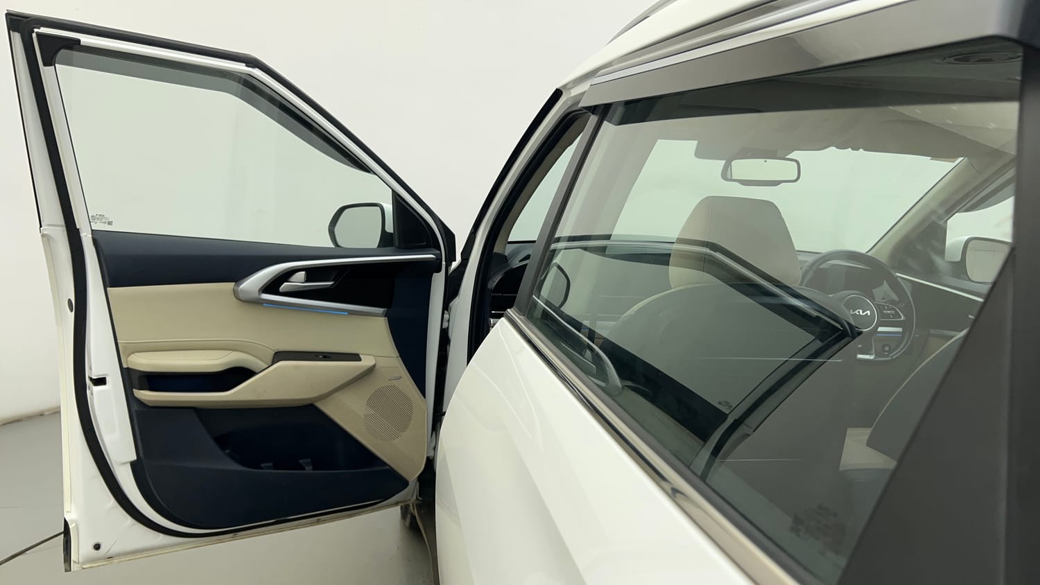 Used 2022 Kia Carens Luxury Plus 1.4 Petrol 7 STR Petrol Manual interior LEFT FRONT DOOR OPEN VIEW