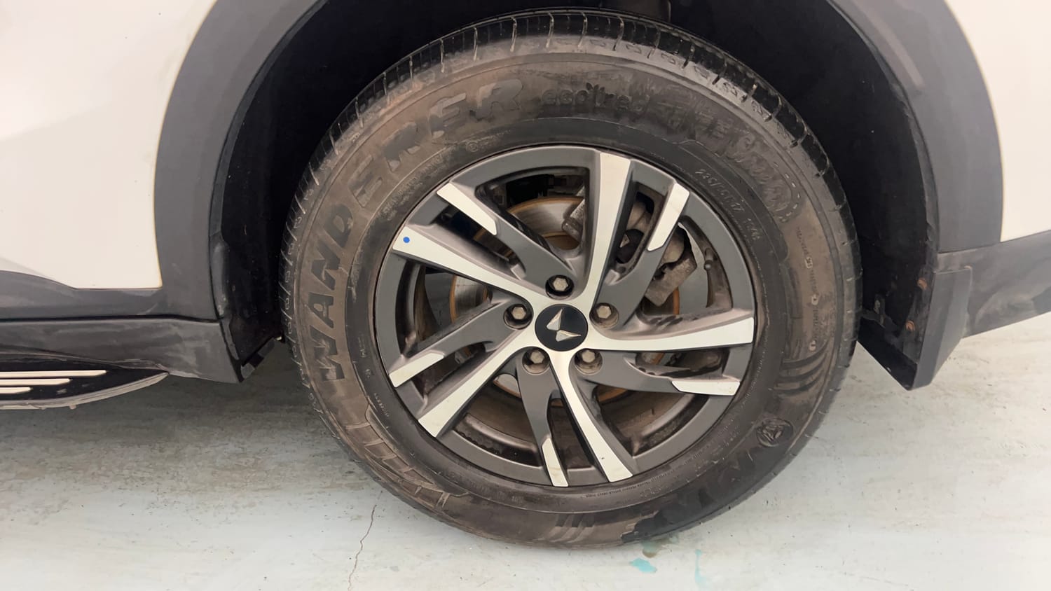 Used 2025 Mahindra XUV700 AX5 Petrol MT 7 STR Petrol Manual tyres LEFT REAR TYRE RIM VIEW