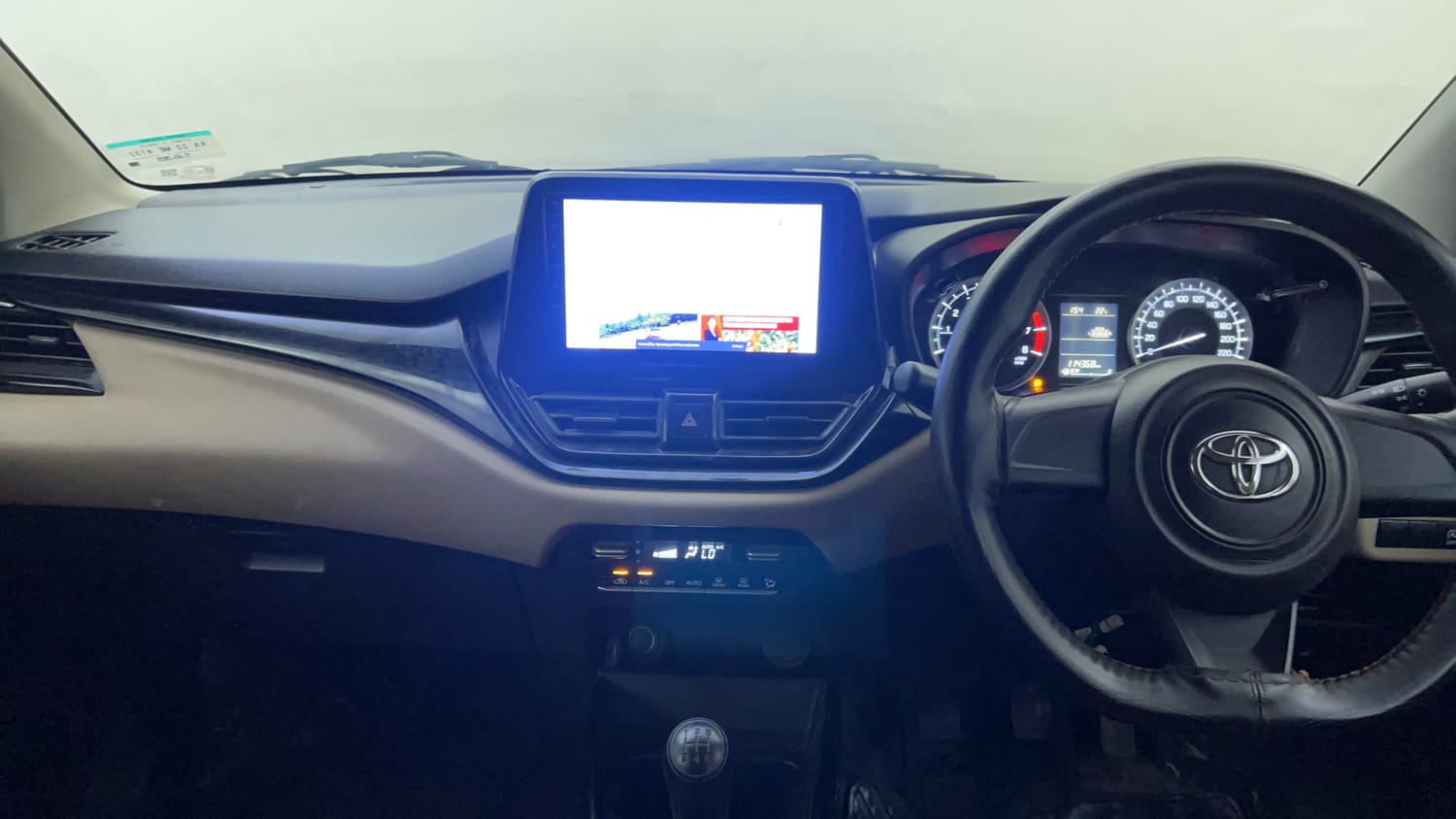 Used 2025 Toyota Glanza E Petrol Manual interior MUSIC SYSTEM & AC CONTROL VIEW