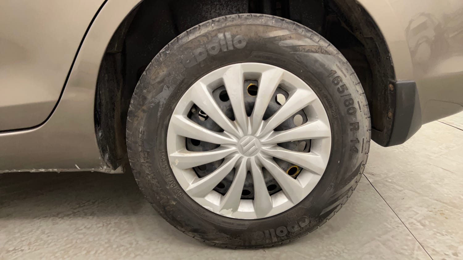 Used 2015 Maruti Suzuki Swift Dzire VXI Petrol Manual tyres LEFT REAR TYRE RIM VIEW