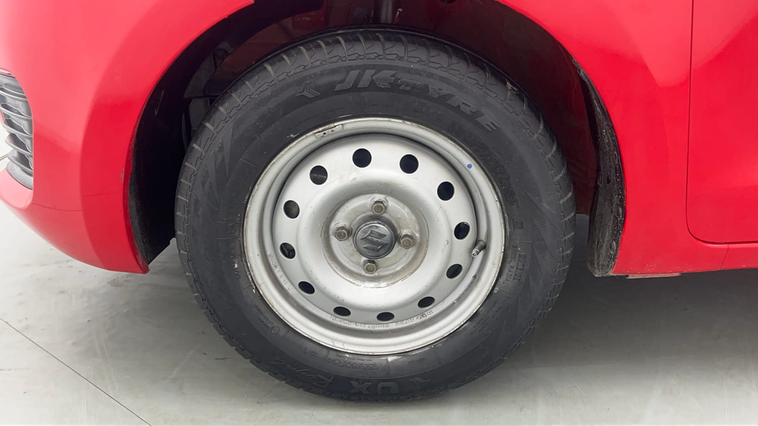 Used 2022 Maruti Suzuki Swift LXi Petrol Manual tyres LEFT FRONT TYRE RIM VIEW