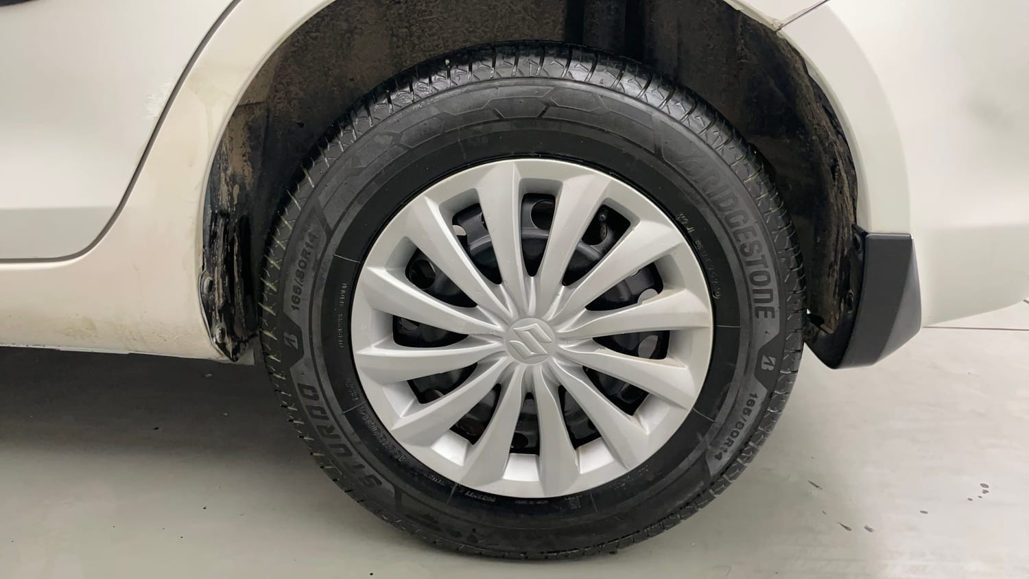 Used 2015 Maruti Suzuki Swift Dzire VXI Petrol Manual tyres LEFT REAR TYRE RIM VIEW