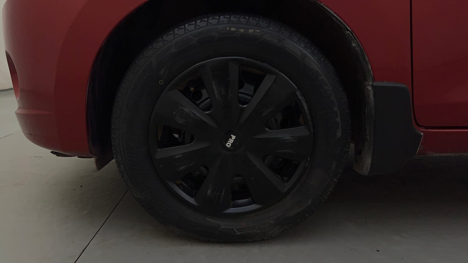 Used 2015 Maruti Suzuki Celerio VXi AMT Petrol Automatic tyres LEFT FRONT TYRE RIM VIEW