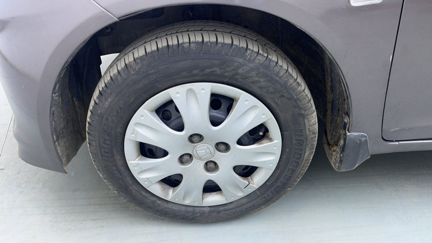 Used 2013 Honda Brio S(O)MT Petrol Manual tyres LEFT FRONT TYRE RIM VIEW