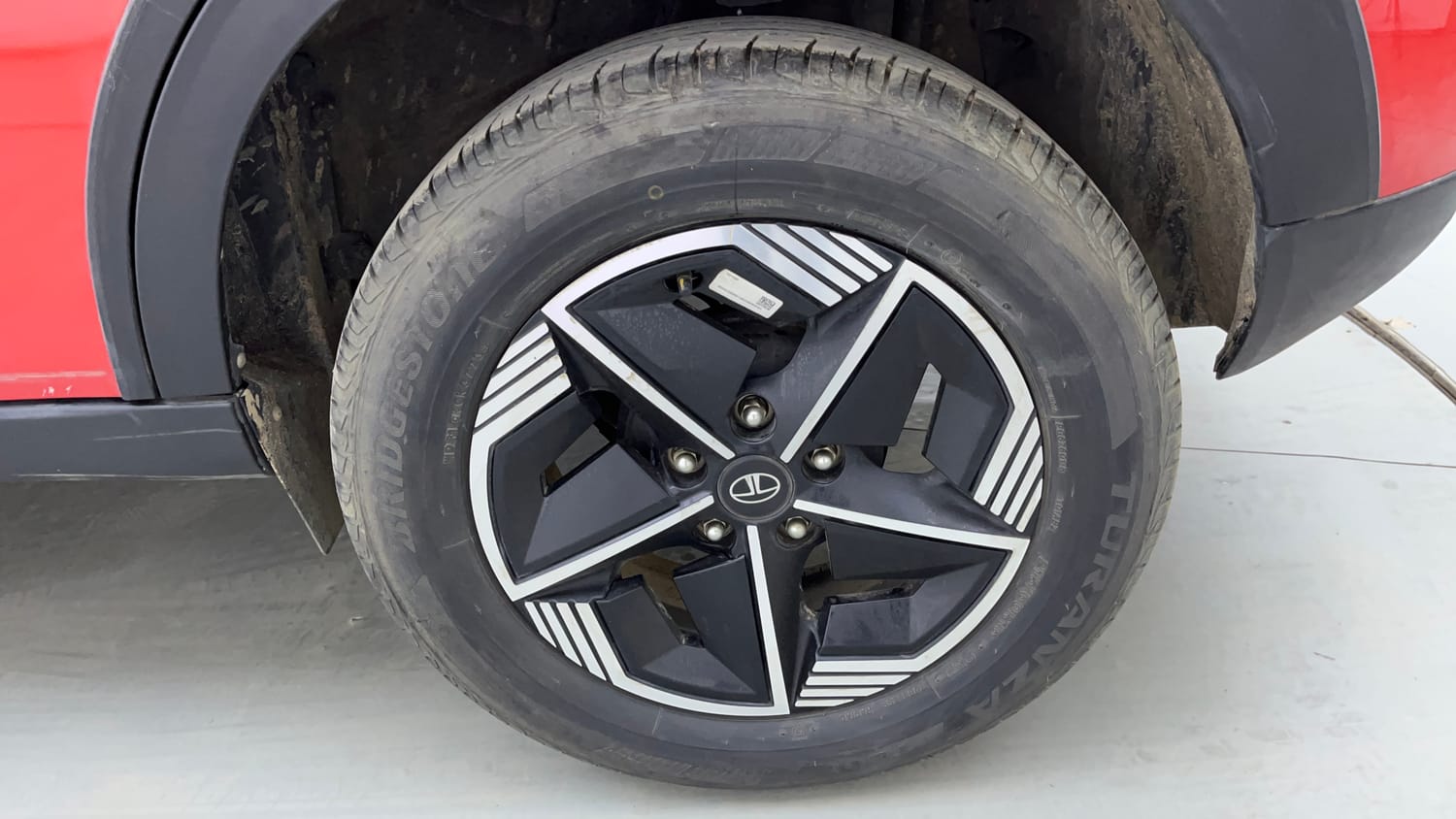 Used 2024 Tata Nexon Fearless Plus S 1.2 Revotron Petrol 6MT DT Petrol Manual tyres LEFT REAR TYRE RIM VIEW