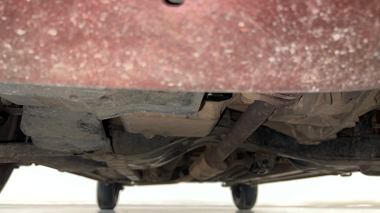 Used 2015 Maruti Suzuki Celerio VXi AMT Petrol Automatic extra FRONT LEFT UNDERBODY VIEW