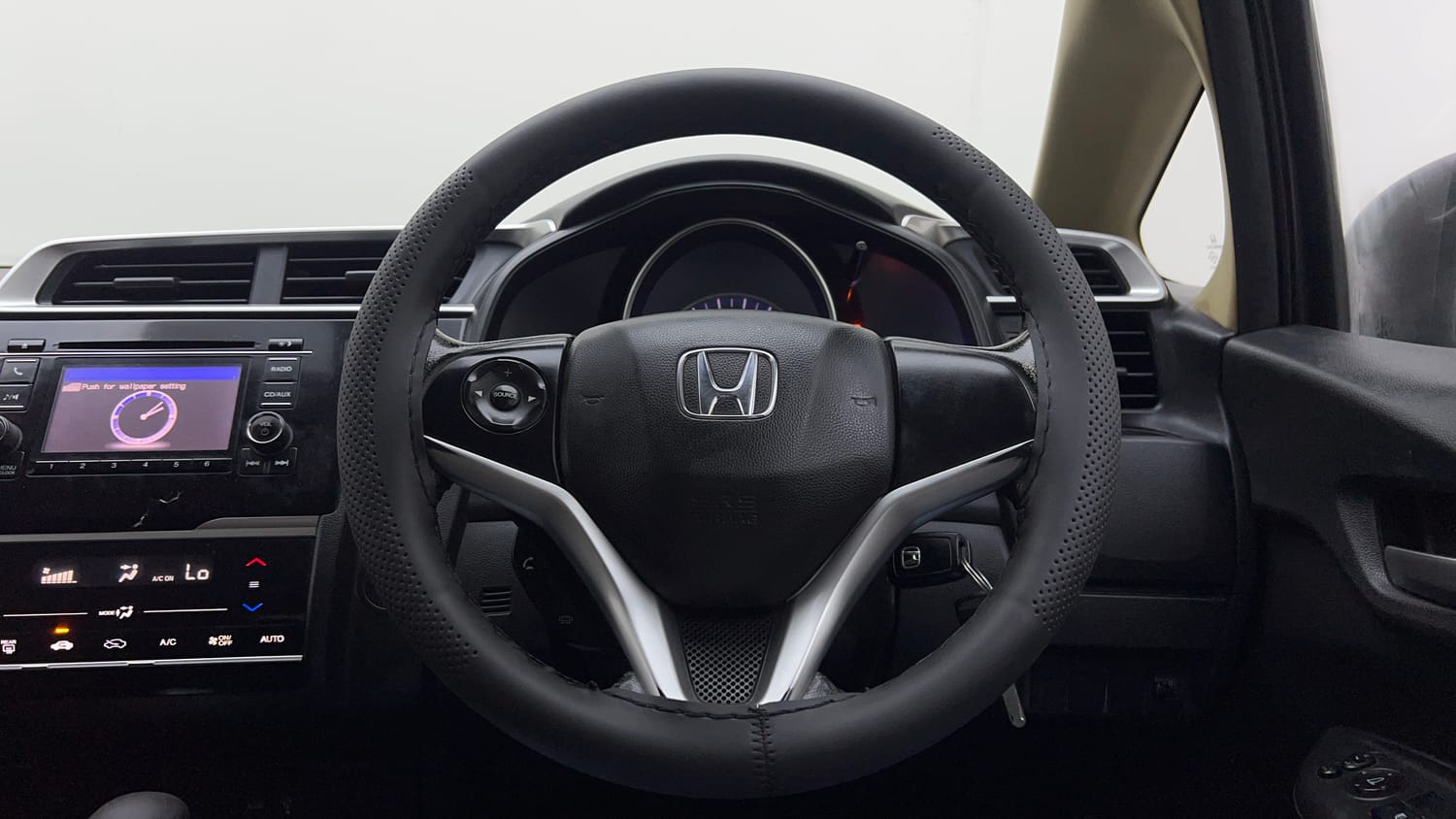 Used 2015 Honda Jazz V AT Petrol Petrol Automatic interior STEERING VIEW