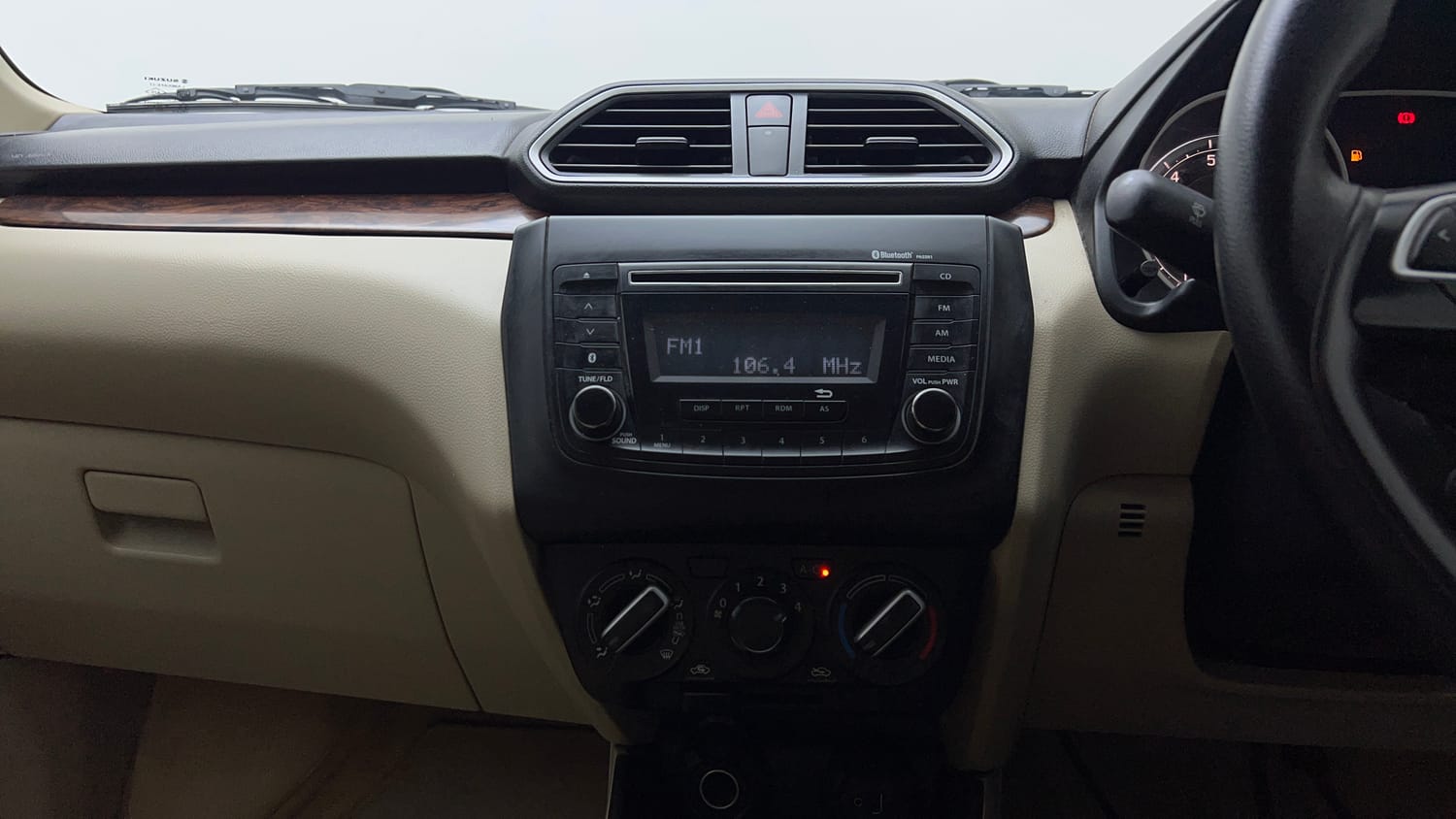 Used 2018 Maruti Suzuki Dzire VXi Petrol Manual top_features Integrated (in-dash) music system