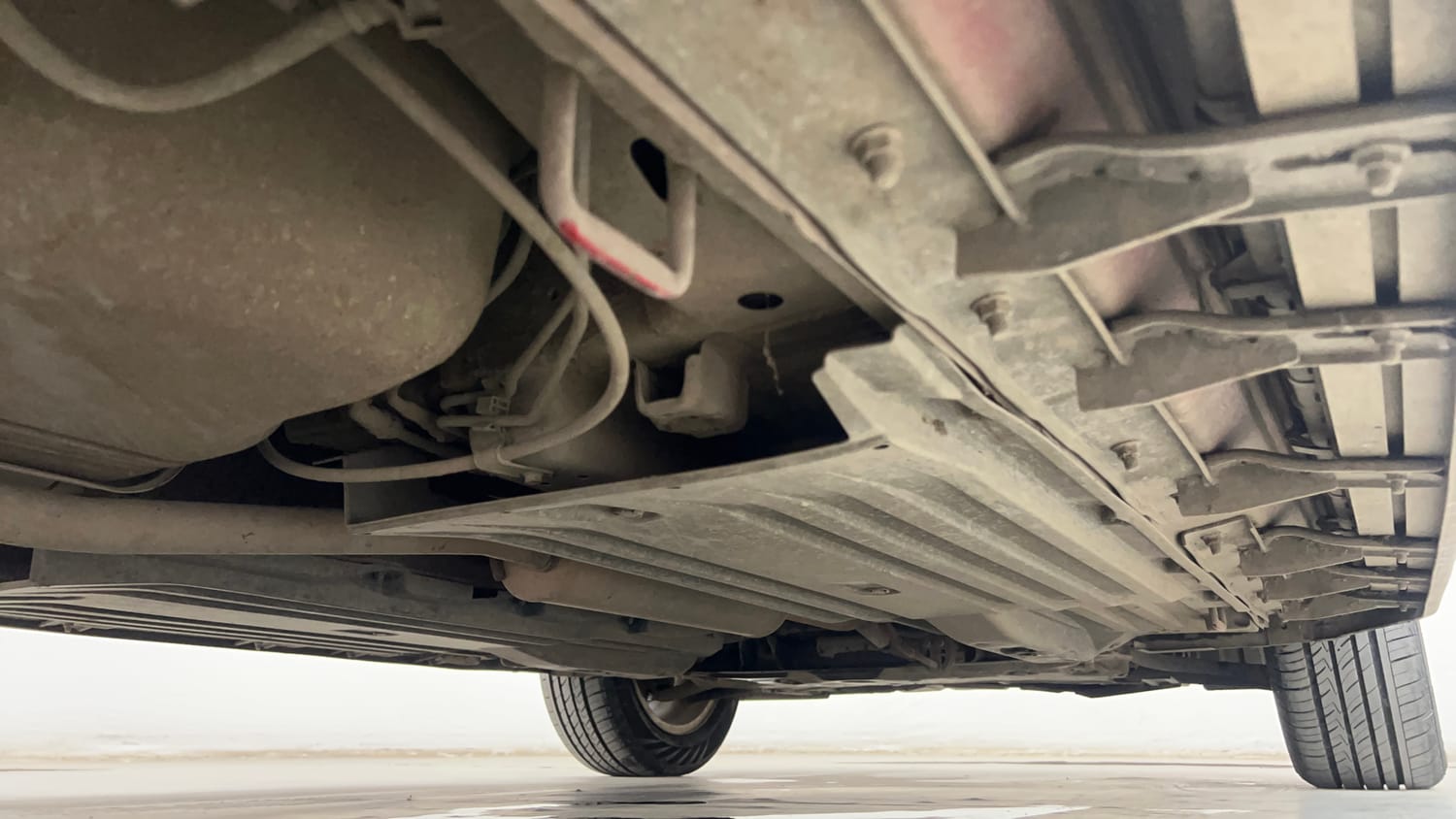 Used 2022 Maruti Suzuki Brezza Zxi Plus AT Dual Tone Petrol Automatic extra REAR RIGHT UNDERBODY VIEW