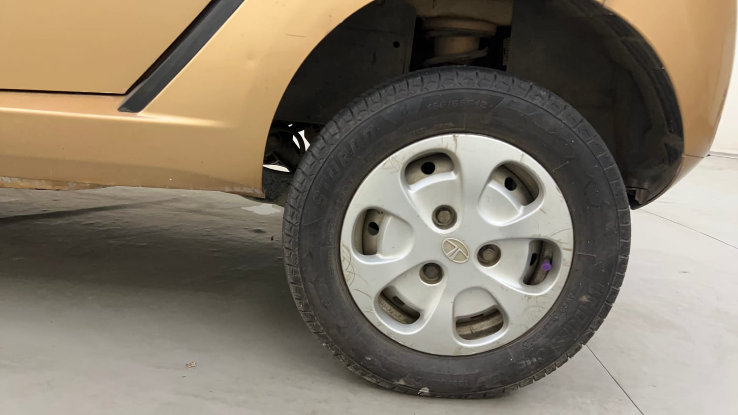 Used 2015 Tata Nano Twist XTA Petrol Automatic tyres LEFT REAR TYRE RIM VIEW
