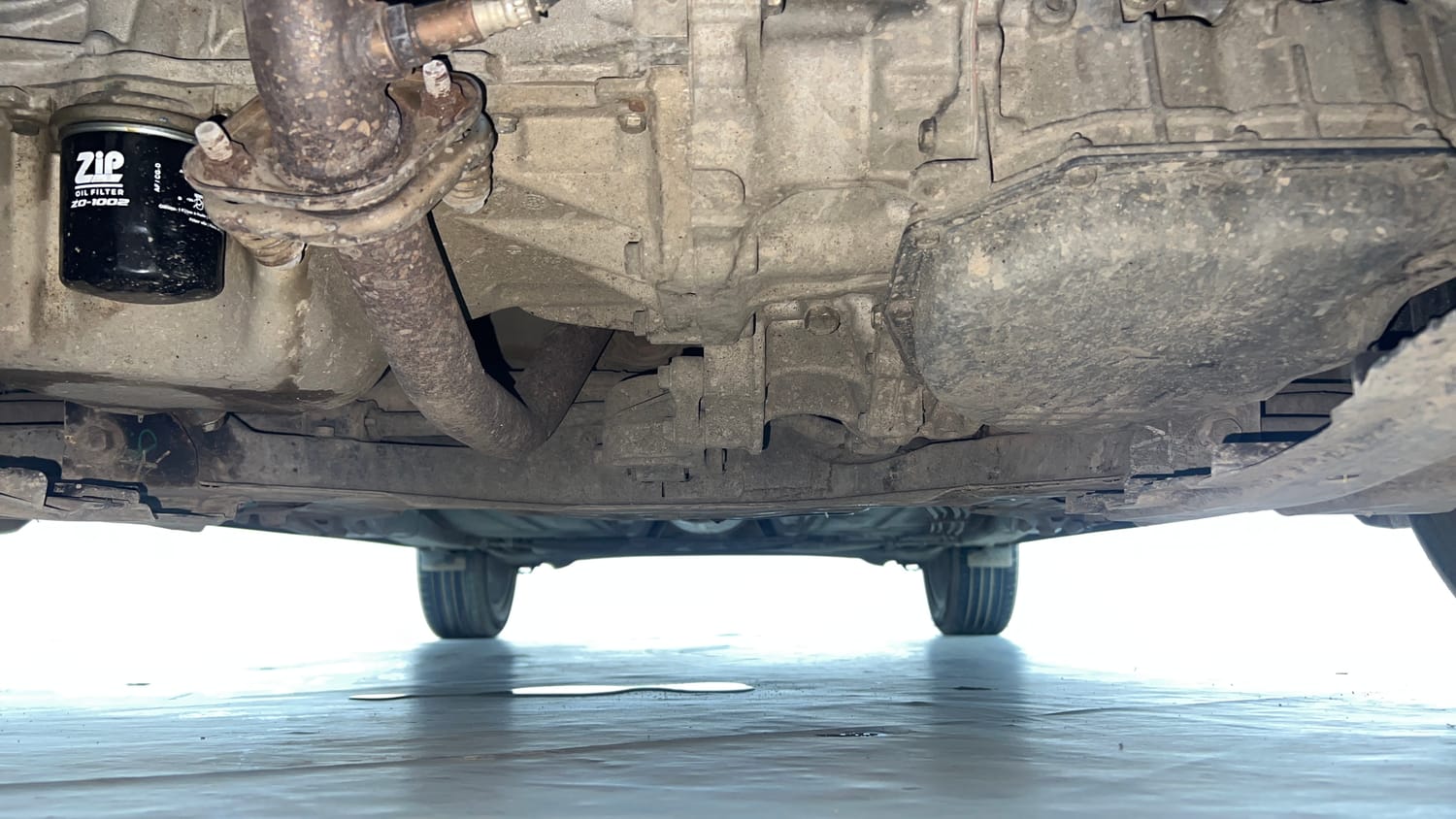 Used 2021 Toyota Glanza V CVT Petrol Automatic extra FRONT LEFT UNDERBODY VIEW