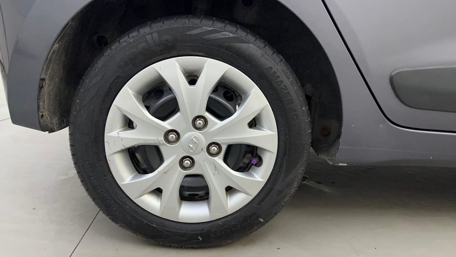 Used 2014 Hyundai Grand i10 Sportz 1.2 Kappa VTVT Petrol Manual tyres RIGHT REAR TYRE RIM VIEW