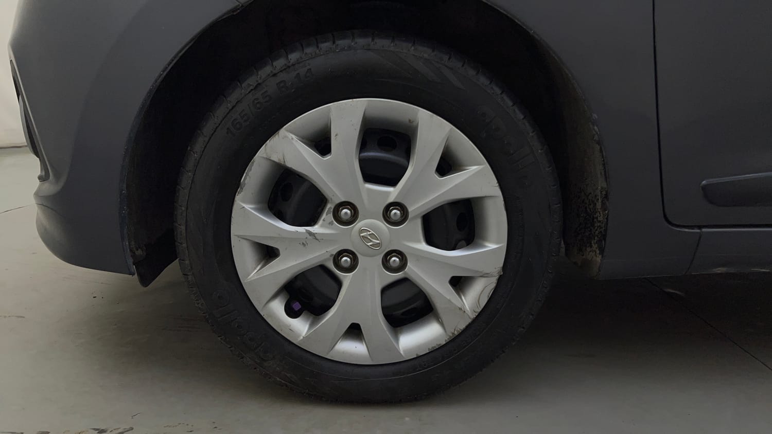 Used 2014 Hyundai Grand i10 Sportz 1.2 Kappa VTVT Petrol Manual tyres LEFT FRONT TYRE RIM VIEW