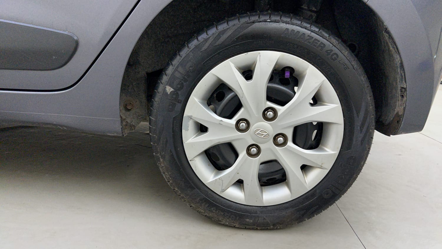 Used 2014 Hyundai Grand i10 Sportz 1.2 Kappa VTVT Petrol Manual tyres LEFT REAR TYRE RIM VIEW