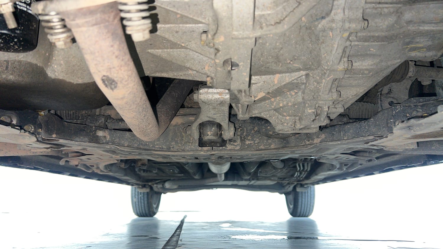 Used 2022 Maruti Suzuki XL6 Alpha Plus MT Petrol Petrol Manual extra FRONT LEFT UNDERBODY VIEW