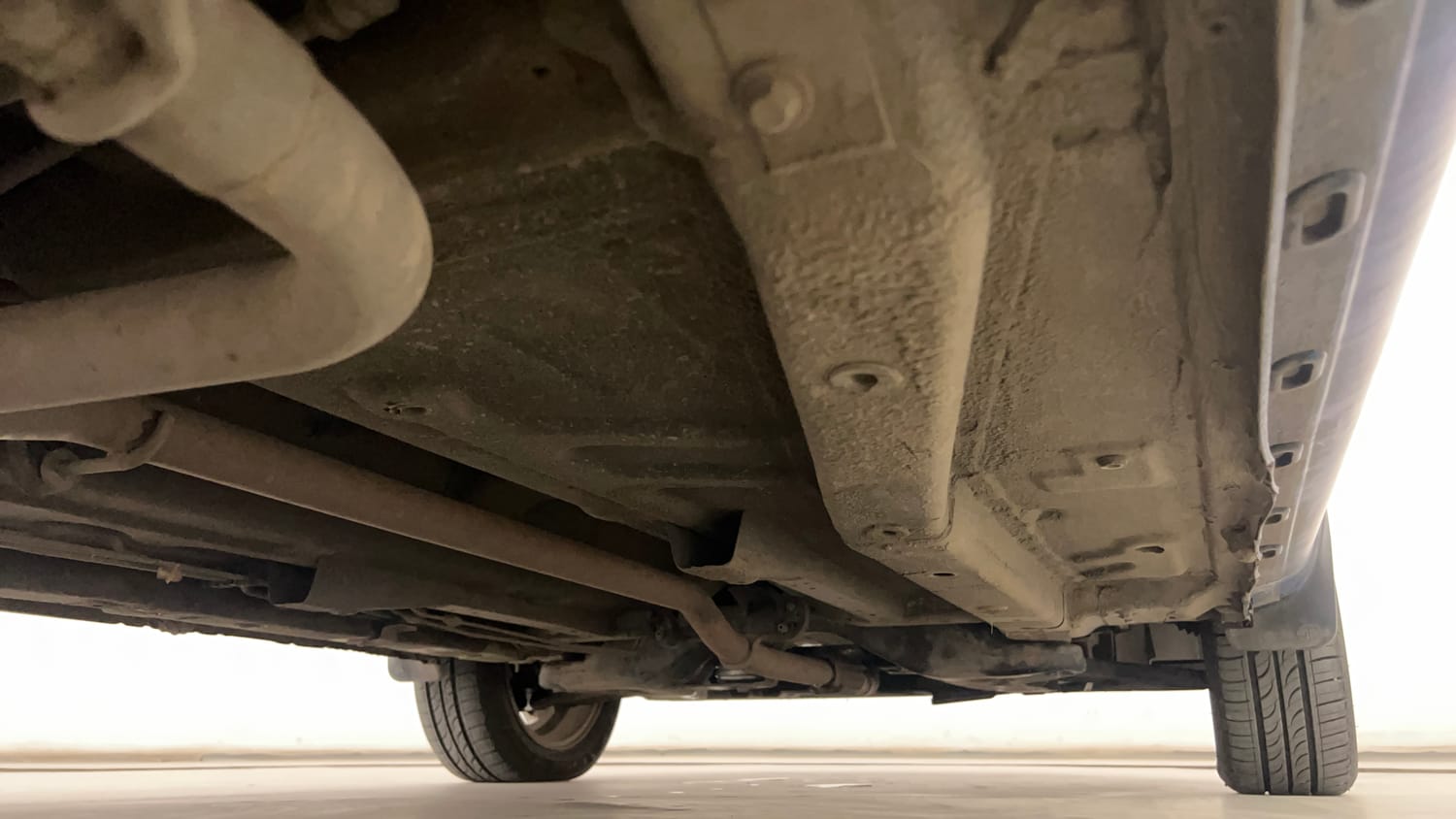 Used 2015 Tata Zest XT Petrol Petrol Manual extra REAR RIGHT UNDERBODY VIEW