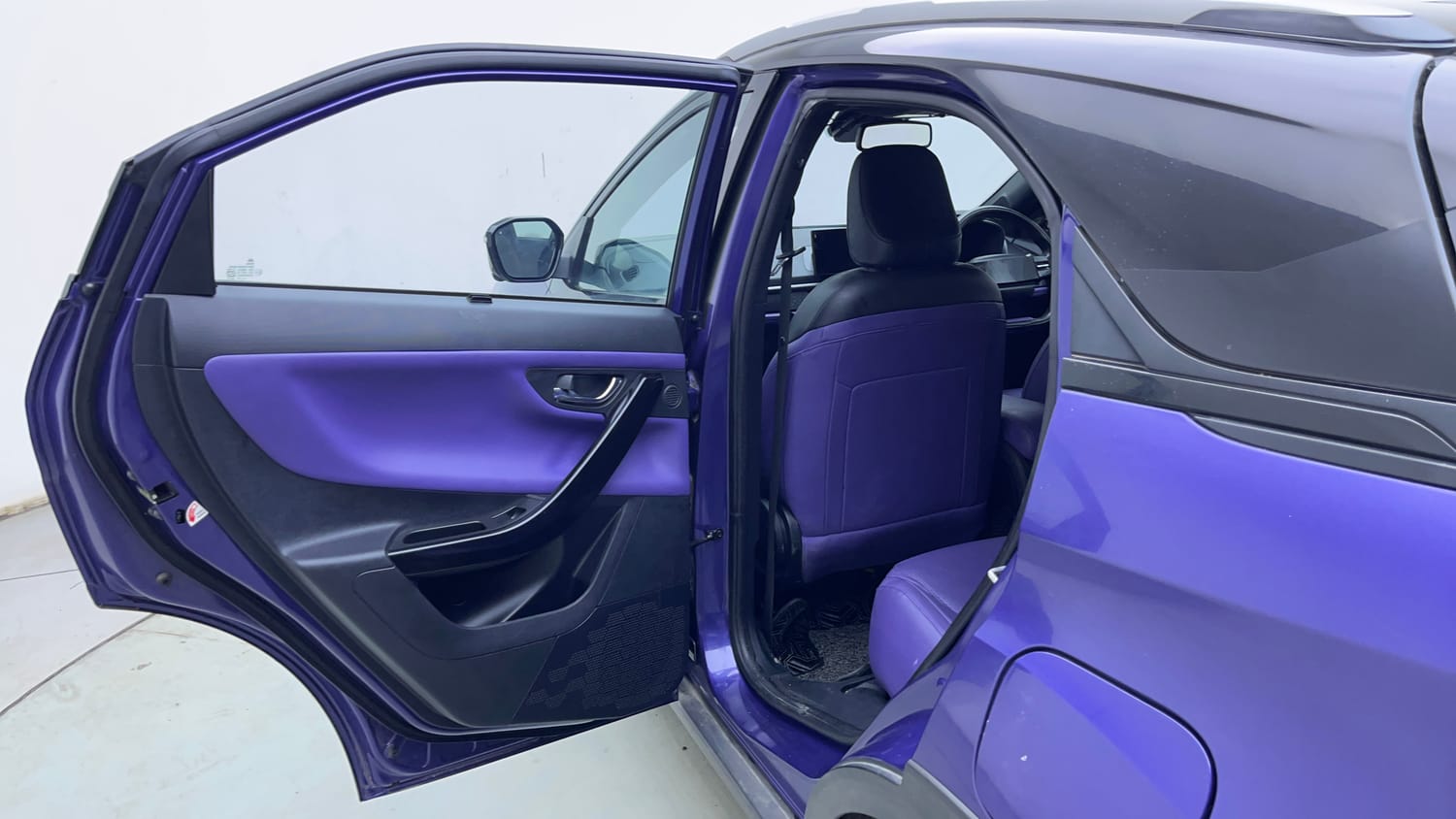 Used 2024 Tata Nexon Fearless Plus S Purple 1.2 Revotron Petrol 7DCA Dual Tone Petrol Automatic interior LEFT REAR DOOR OPEN VIEW