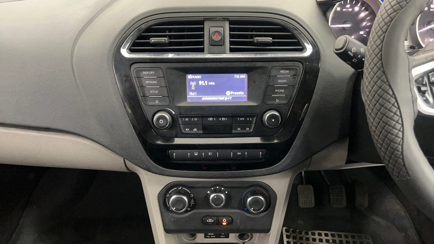 Used 2016 Tata Tiago Revotron XZ Petrol Manual interior MUSIC SYSTEM & AC CONTROL VIEW