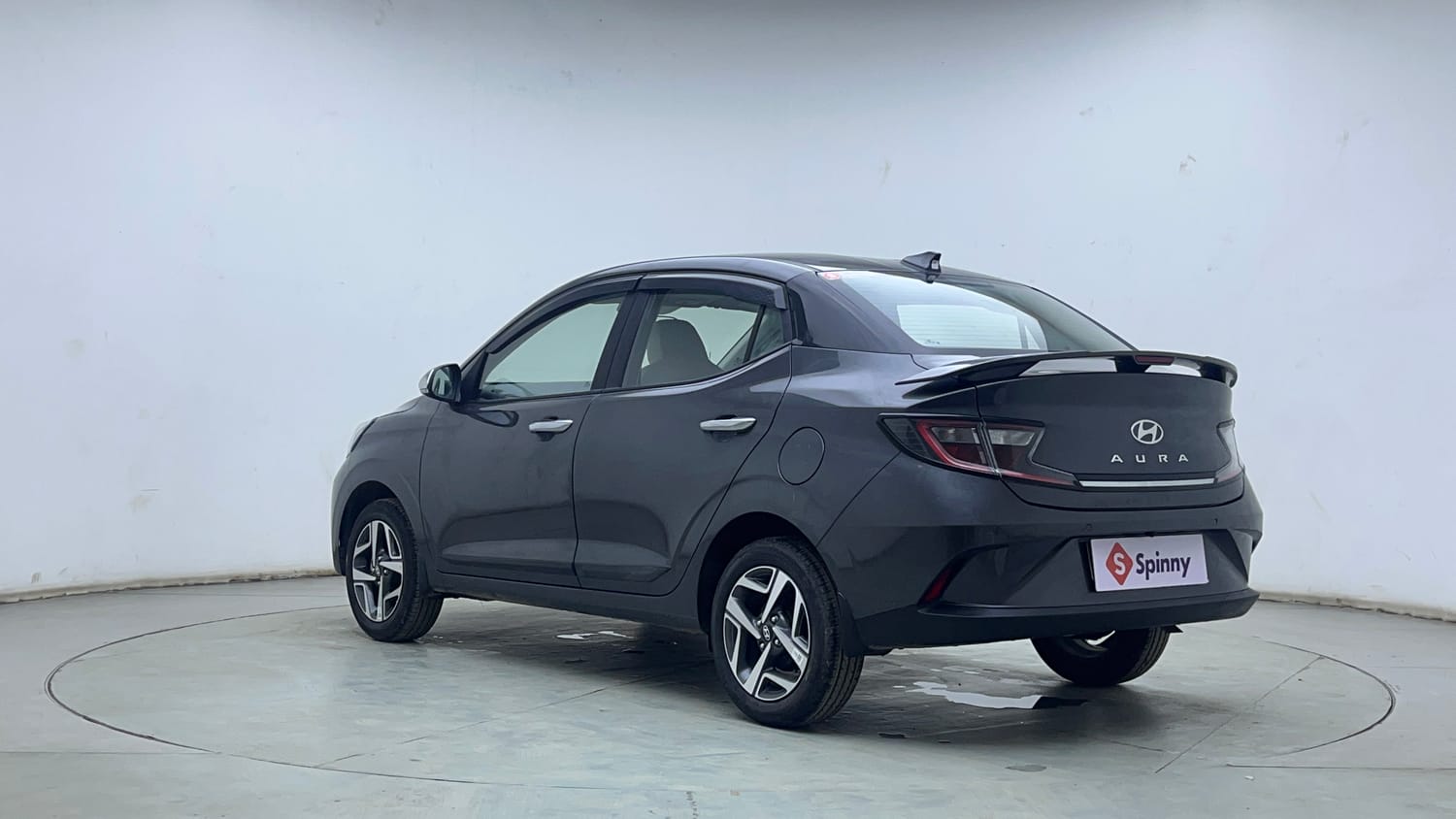 Used 2026 Hyundai Aura SX Plus 1.2 AMT Petrol Petrol Automatic exterior LEFT REAR CORNER VIEW