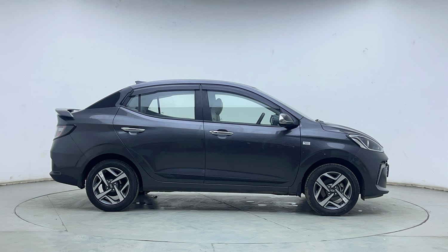 Used 2026 Hyundai Aura SX Plus 1.2 AMT Petrol Petrol Automatic exterior RIGHT SIDE VIEW