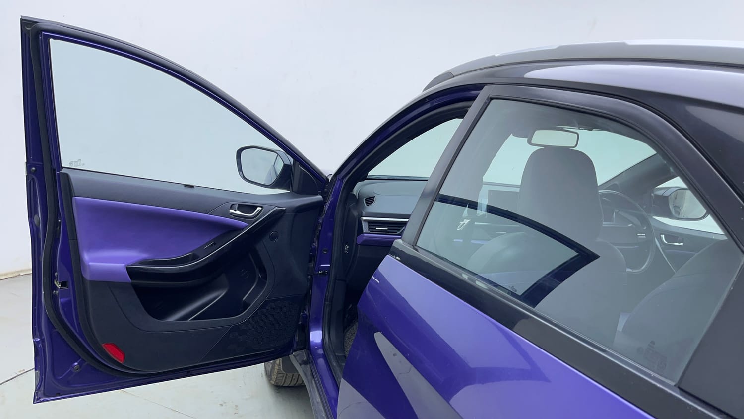 Used 2024 Tata Nexon Fearless Plus S Purple 1.2 Revotron Petrol 7DCA Dual Tone Petrol Automatic interior LEFT FRONT DOOR OPEN VIEW