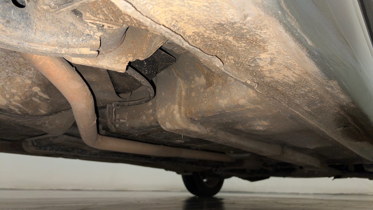 Used 2014 Hyundai Xcent SX AT 1.2 (O) Petrol Automatic extra REAR RIGHT UNDERBODY VIEW