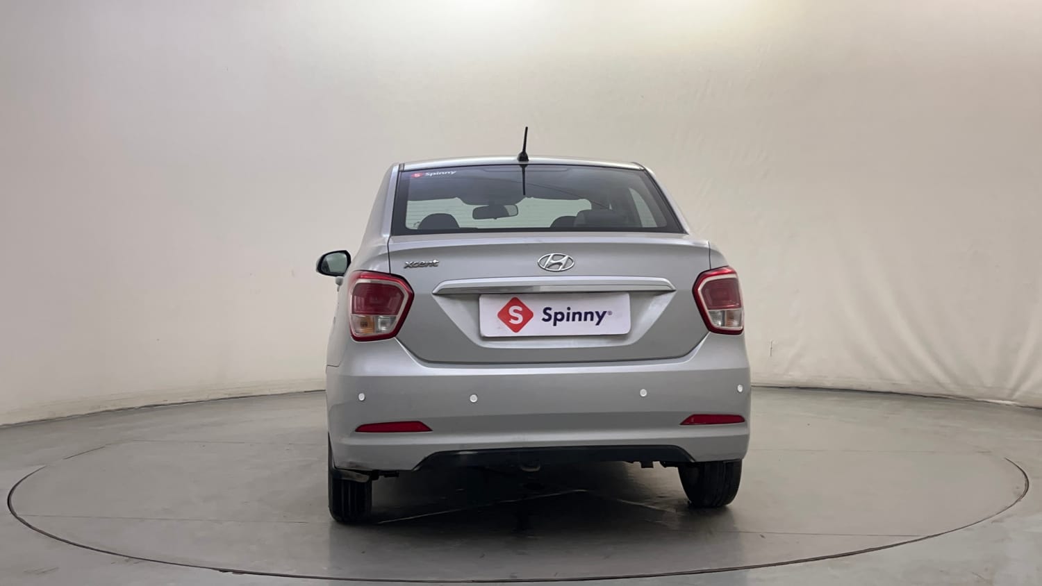 Used 2014 Hyundai Xcent SX AT 1.2 (O) Petrol Automatic exterior BACK VIEW