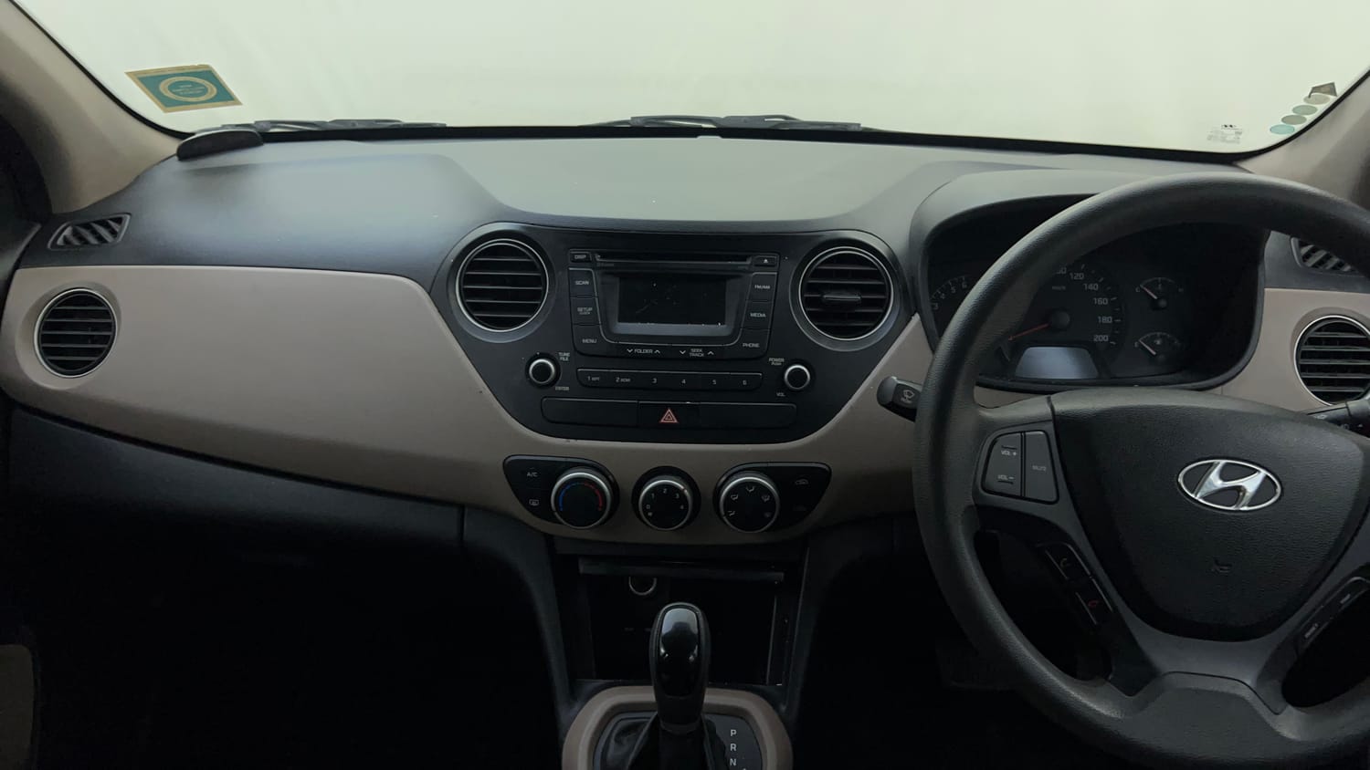 Used 2014 Hyundai Xcent SX AT 1.2 (O) Petrol Automatic interior MUSIC SYSTEM & AC CONTROL VIEW
