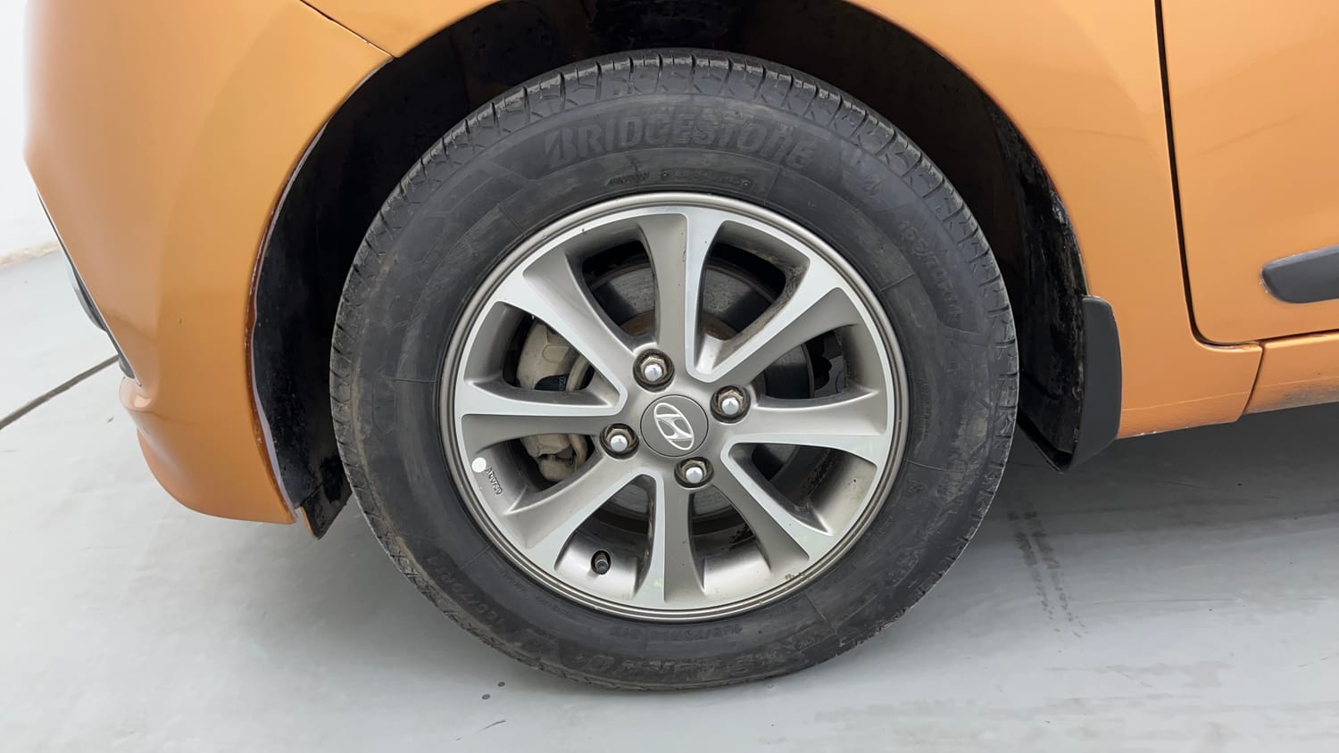 Used 2014 Hyundai Grand i10 Asta 1.2 Kappa VTVT (O) Petrol Manual tyres LEFT FRONT TYRE RIM VIEW