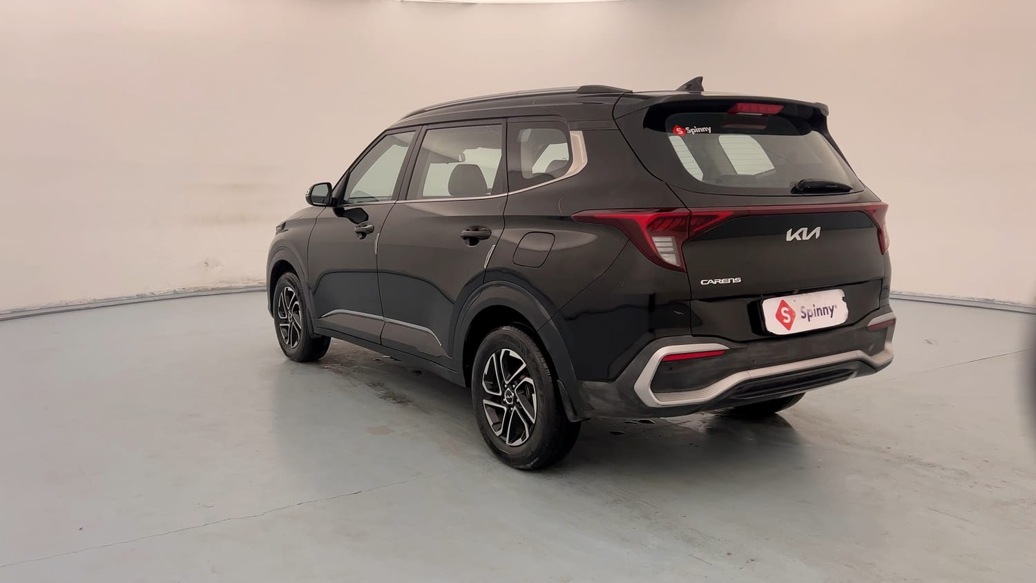 Used 2022 Kia Carens Prestige Plus 1.4 Petrol MT 7 STR Petrol Manual exterior LEFT REAR CORNER VIEW